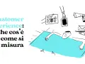 Customer Experience: che cos'è e come si misura. Un uomo rilassato su un lettino blu, circondato da mani che offrono dispositivi digitali e comunicazioni, per una perfetta digital experience.