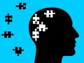 Silhouette di testa con pezzi di puzzle bianchi all'interno, che simboleggiano l'economia dell'attenzione.