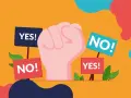 Pugno chiuso con cartelli "YES!" e "NO!". Un'immagine che simboleggia la scelta, il dibattito, il "woke washing" che cerca di influenzare le decisioni.