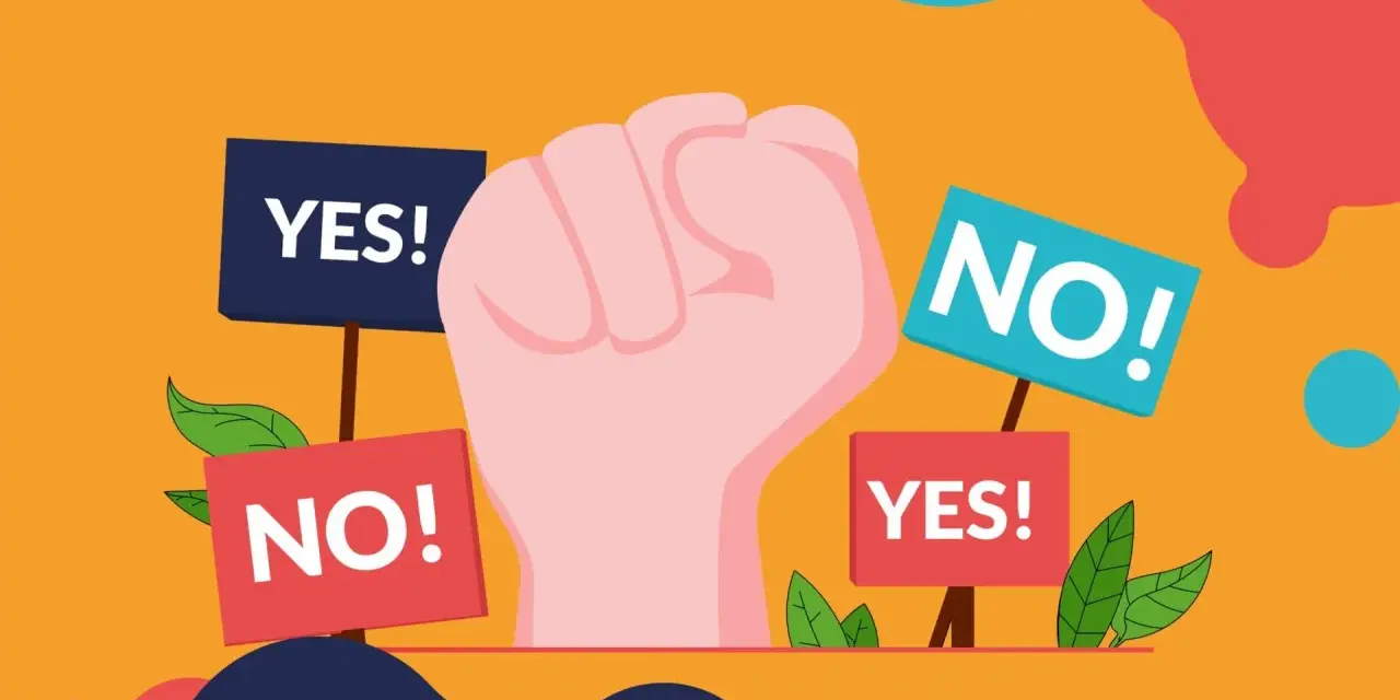 Pugno chiuso con cartelli "YES!" e "NO!". Un'immagine che simboleggia la scelta, il dibattito, il "woke washing" che cerca di influenzare le decisioni.