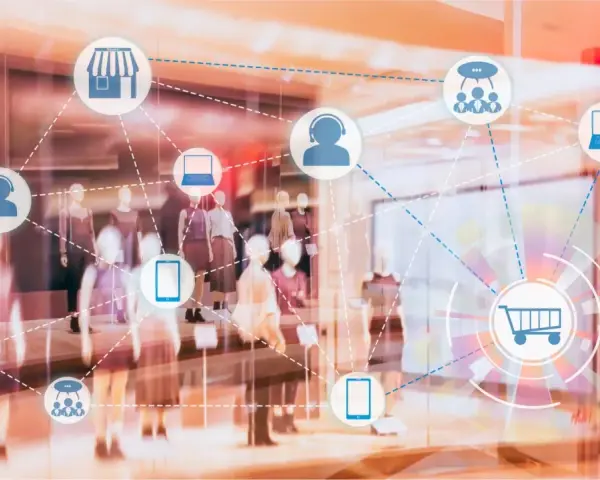 Icone di un negozio, carrello, cuffie e dispositivi connessi in una vetrina, che illustrano il retail significato.